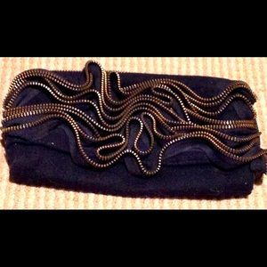 Black cool zip designed front, clutch with tags